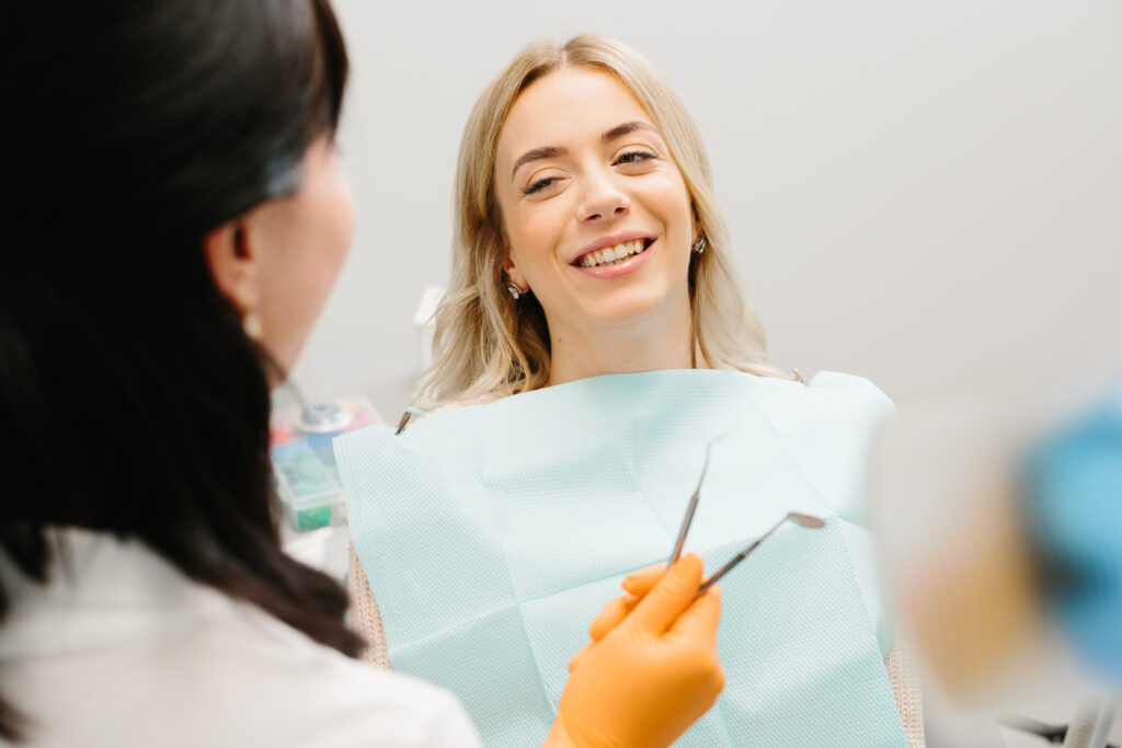 Doctor talking with her patient. Dentist concept