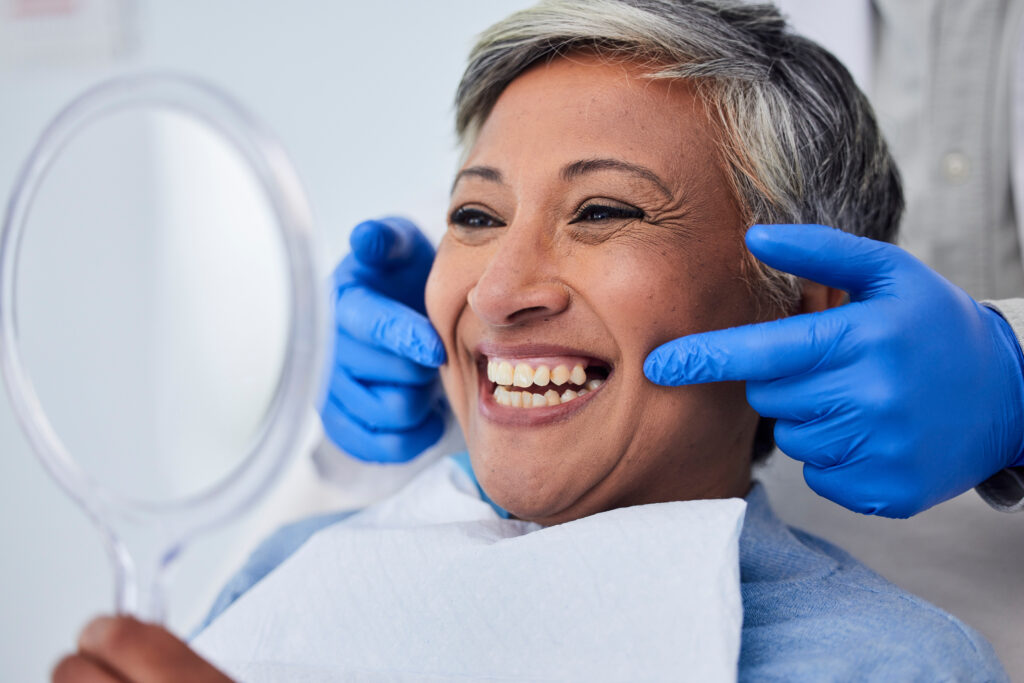 Senior woman, teeth and smile for dentist in dental care, appointment or checkup at the clinic. Happy elderly female person smile for tooth whitening, cleaning or oral, mouth and gum care at hospital.
