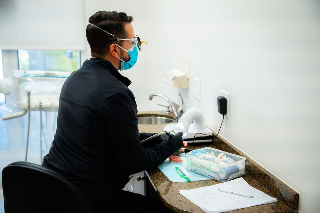 dr binns working on a denture