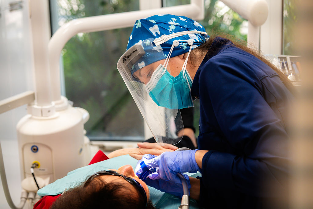 dr forlano helping a patient