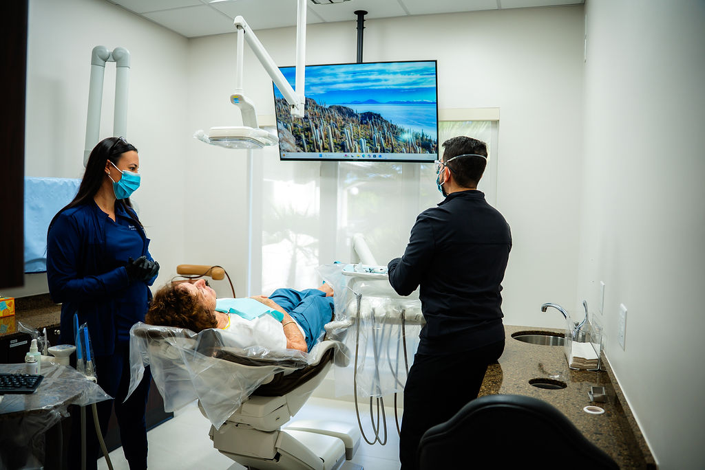 a dentist and assistant working