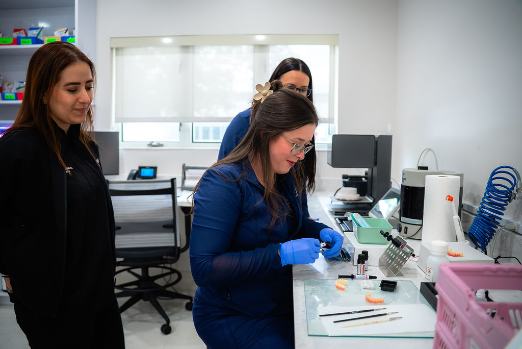 three women from advanced prosthodontics and implant center